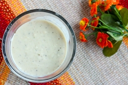 Ingredients for Cream of Chicken Soup laid out on a wooden cutting board